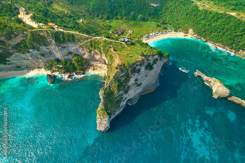 Cinematic aerial landscape shots of the beautiful island Diamond beach of Nusa Penida. Huge cliffs by the shoreline and hidden dream beaches with clear water. © Kate