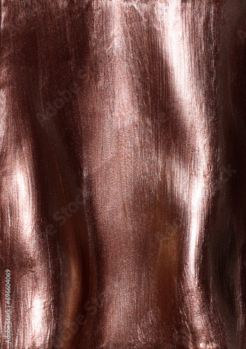 Copper metallic shimmering glossy nail polish composition background. Cosmetic makeup product texture photo