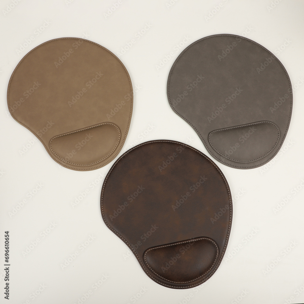 Leather mousepads in different colors. Concept shot, top view. Custom background, leather mousepad. Free space for text. Leather mousepads in different colors. Concept shot, top view. Custom background, leather mousepad. Free space for text.