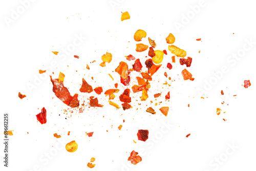 Close up spicy chili red pepper flakes, chopped, milled dry paprika pile isolated on white photo