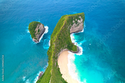 Cinematic aerial landscape shots of the beautiful island dinosaur of Nusa Penida. Huge cliffs by the shoreline and hidden dream beaches with clear water.