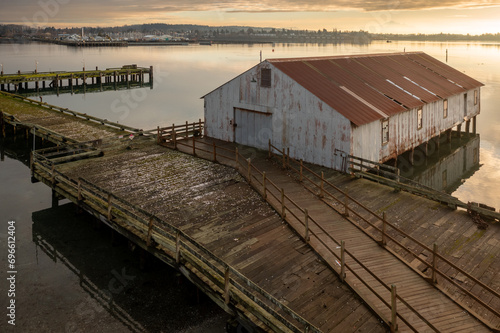 Old aged Semiahmoo Cannery Building at Tounge Point on Semiahmoo Spit in Blaine, WA.  Salmon canning was once a roaring business here on the Semiahmoo Spit that brought many businesses to the spit. photo