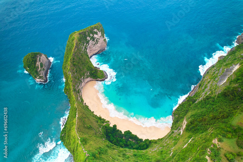 Cinematic aerial landscape shots of the beautiful island dinosaur of Nusa Penida. Huge cliffs by the shoreline and hidden dream beaches with clear water. © Kate