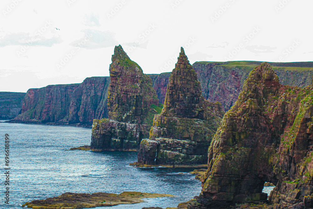 Seaside Serenity: Discover John o' Groats, Highland's Natural Beauty, NC500 north coast route in Scotland. landscape of duncansby stacks