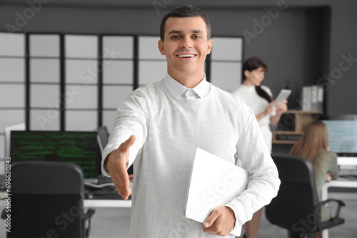 Male programmer with laptop...