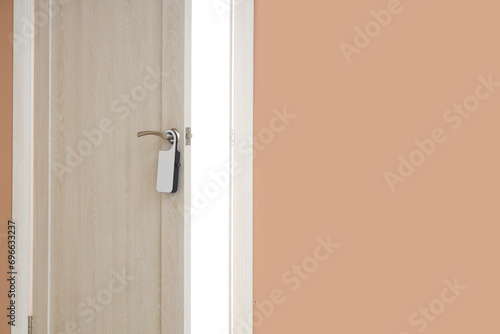 Open wooden door with hange...