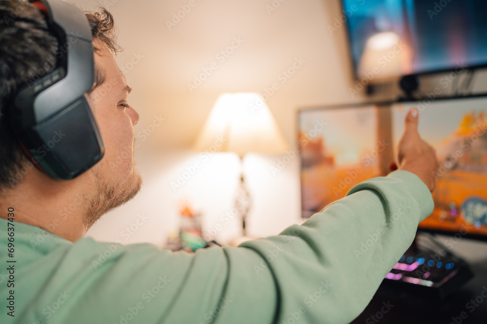 Gamer gesturing while playing console at home Gamer gesturing while playing console at home