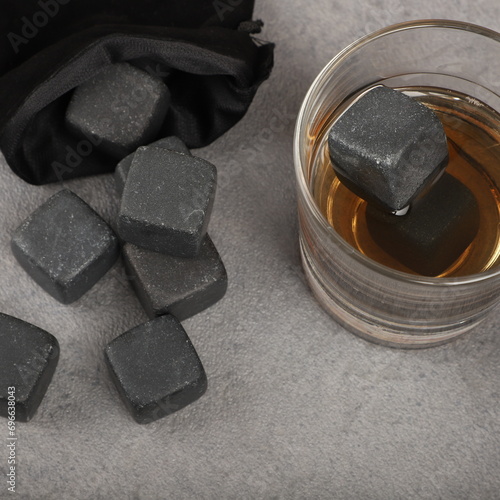 фотографія Whiskey cooler set gray soapstone stones close up