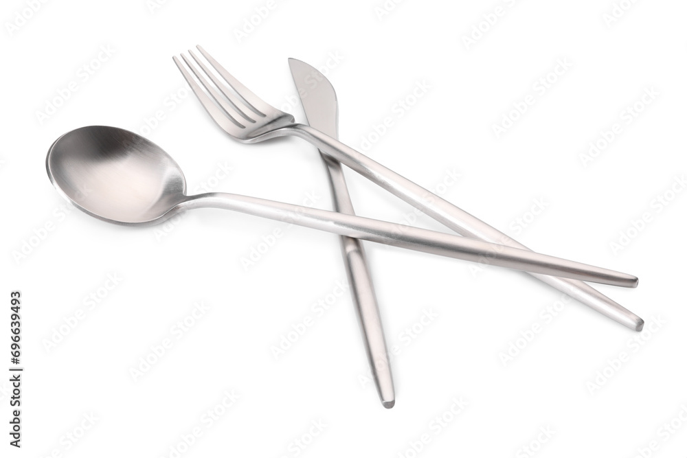 Shiny silver fork, knife and spoon isolated on white. Luxury cutlery set Shiny silver fork, knife and spoon isolated on white. Luxury cutlery set