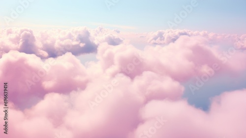A group of clouds spelling out I Love You in the sky, with a soft pink haze surrounding the words. photo