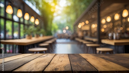 Wood table on a blur of cafe, coffee shop, bar, background.