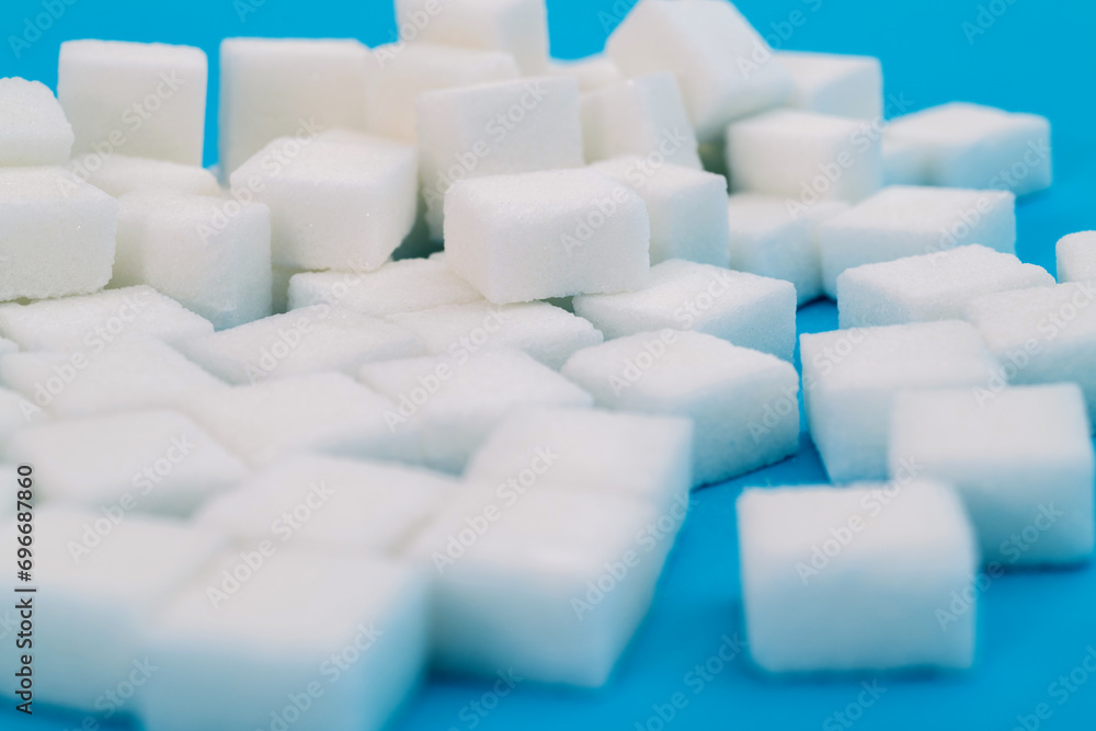 Sugar cubes on blue background Sugar cubes on blue background