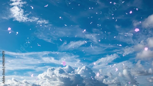 雲が流れる青空に舞い散る花びら　イベント・ウエディング・フラワーシャワー・イベント・幸せ,お祝い,発表 photo
