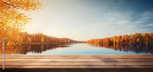Wooden table with waterside retreat. Immerse in breathtaking beauty of nature serene lakeside haven. Sun sets or rises warm rays paint sky with spectrum of colors casting golden glow over landscape © Wuttichai