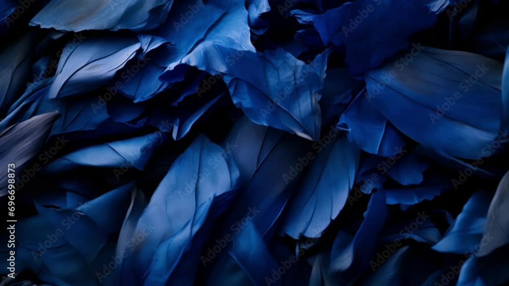 A striking of a pile of indigo leaves, revealing the source of the popular blue dye used in natural dyeing. A striking of a pile of indigo leaves, revealing the source of the popular blue dye used in natural dyeing.