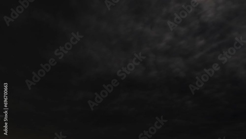 timelapse of spooky black night sky clouds photo