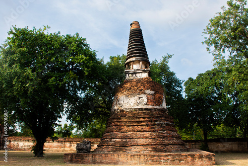 Ancient ruins ubosot ordination hall and antique old ruin stupa chedi for thai people traveler travel visit respect myth mystical in Wat Maheyong temple at Historic Heritage site in Ayutthaya Thailand photo