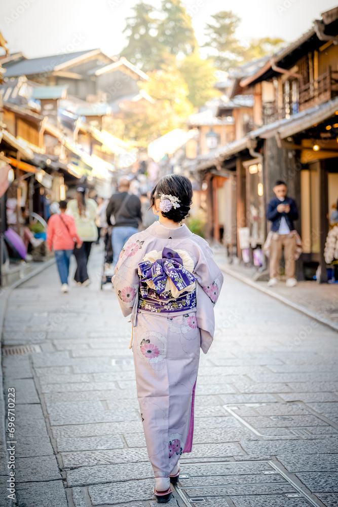 Japanese Kimono Portrait back view photography. Kyoto, Japan. Japanese traditional buildings background.