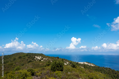 Stunning view down to the sea and the surrounding area from top of the mountain in Ereikoussa island, Greece photo