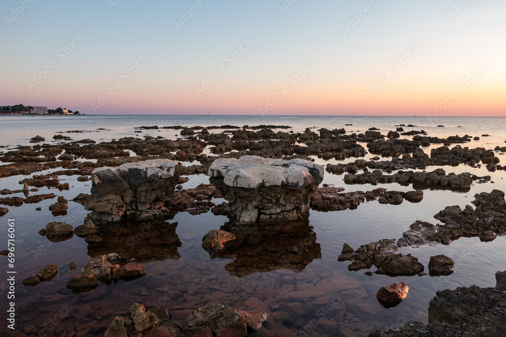 Rocks on sea in sunset