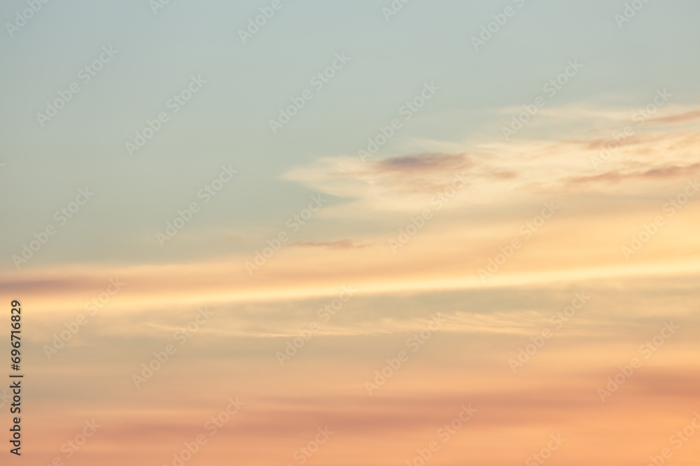 A beautiful sky tinted by the sun leaving vibrant shades of gold, pink, blue and multicolored. Clouds in the twilight evening and morning sky. Image of a cloudy sky in the evening and during the day A beautiful sky tinted by the sun leaving vibrant shades of gold, pink, blue and multicolored. Clouds in the twilight evening and morning sky. Image of a cloudy sky in the evening and during the day
