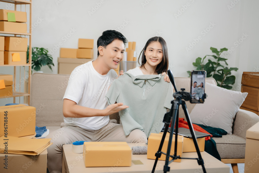 Small business entrepreneur SME freelance Asian man and woman working at home office, BOX, tablet and laptop online, marketing, packaging, delivery.