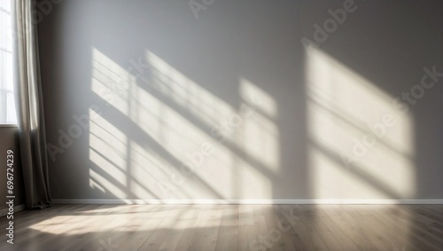 Empty room with grey walls  curtains and light shadow from the window  seen from the front. Modern minimalist background for product presentation or display