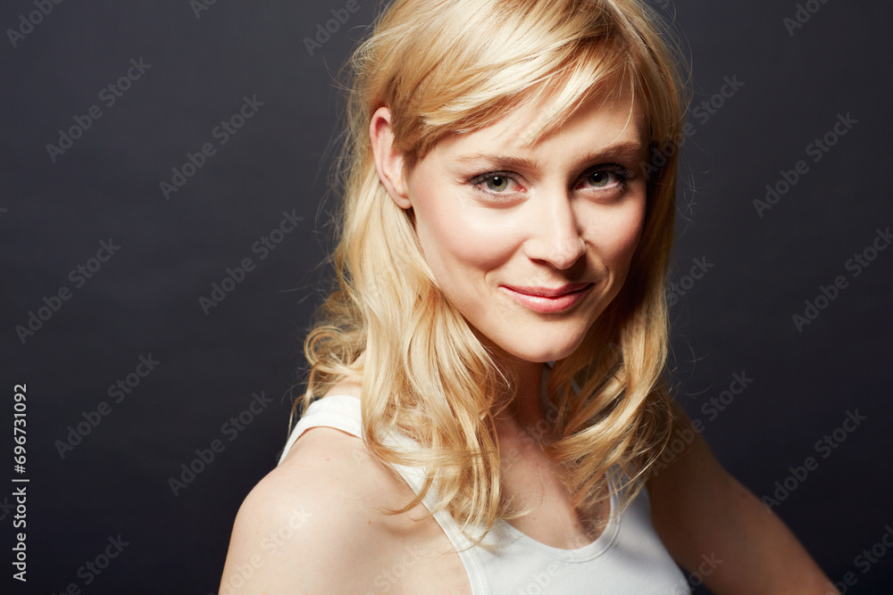 Woman, portrait and beauty with hair and shine, cosmetic care and salon treatment on dark background. Young model from Sweden in studio, healthy haircare for growth and glow with smile on face Woman, portrait and beauty with hair and shine, cosmetic care and salon treatment on dark background. Young model from Sweden in studio, healthy haircare for growth and glow with smile on face