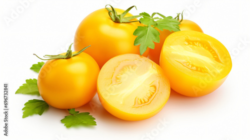 Fresh whole and sliced yellow tomatoes isolated on white background