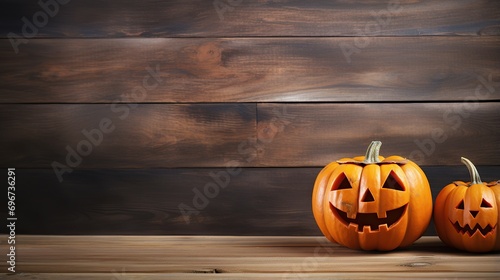 Halloween pumpkin head lantern on a wooden background,on a wooden table. Composition with carved pumpkins and Halloween decorations