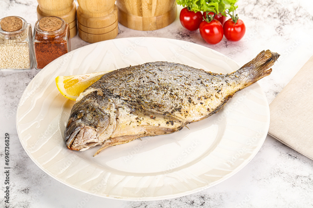 Baked Dorado fish served lemon Baked Dorado fish served lemon