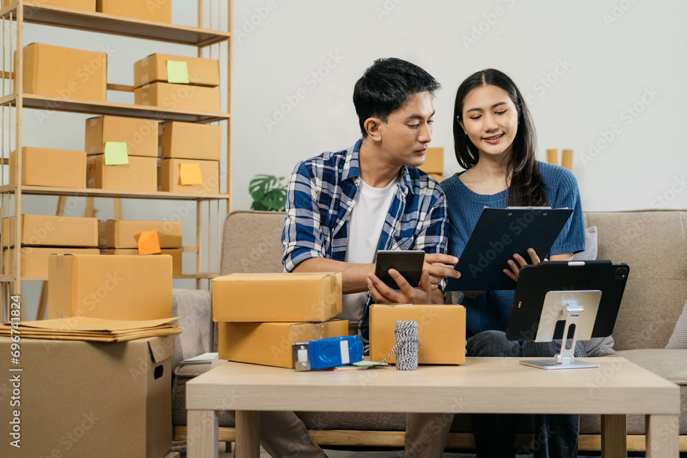 Couple start up small business owner. small business entrepreneur SME or freelance asian couple working with selling products online. Couple start up small business owner. small business entrepreneur SME or freelance asian couple working with selling products online.