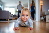 Happy little child crawling at home on the floor in a modern apartment against the background of his parents