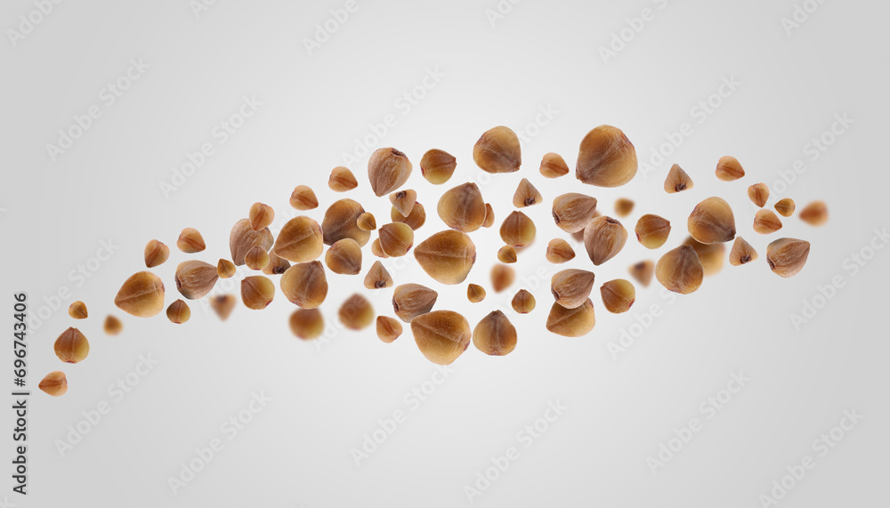 Buckwheat flying on grey background. Grains in air, banner design Buckwheat flying on grey background. Grains in air, banner design