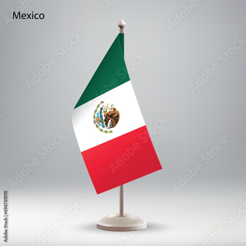 Flag of Mexico hanging on a flag stand.