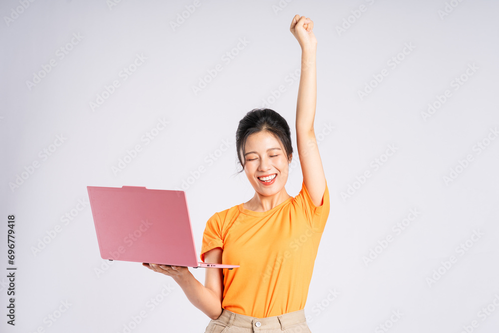 Portrait of cheerful happy Asian woman posing on white background Portrait of cheerful happy Asian woman posing on white background