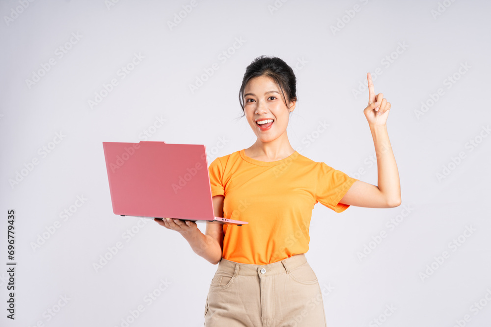 Portrait of cheerful happy Asian woman posing on white background Portrait of cheerful happy Asian woman posing on white background