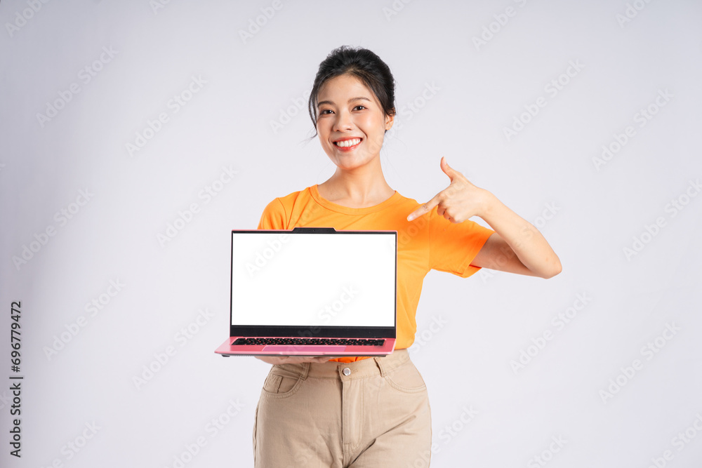 Portrait of cheerful happy Asian woman posing on white background Portrait of cheerful happy Asian woman posing on white background