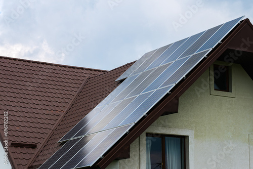 Solar panels installed on the metal roof of the house