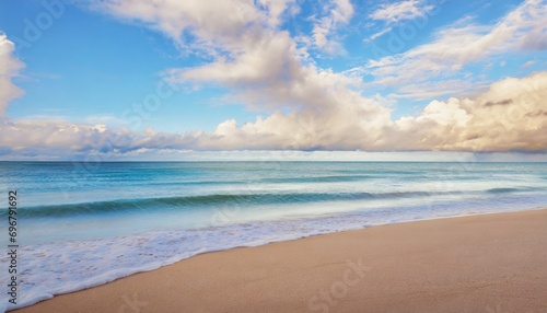beach nature closeup sea waves sandy coast and colorful dreamlike sky clouds relaxing panoramic empty beach landscape copy space peaceful tranquil calm background horizon beautiful natural scene
