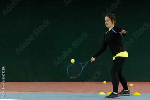 young woman practicing tennis © Merih