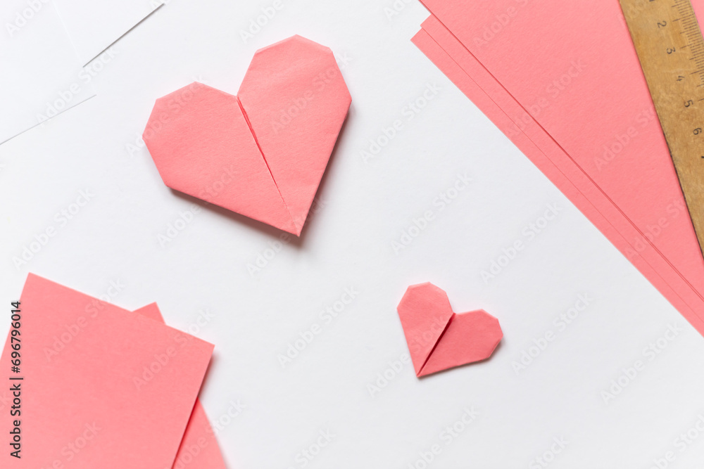 Pink origami hearts. Valentine's day concept card.