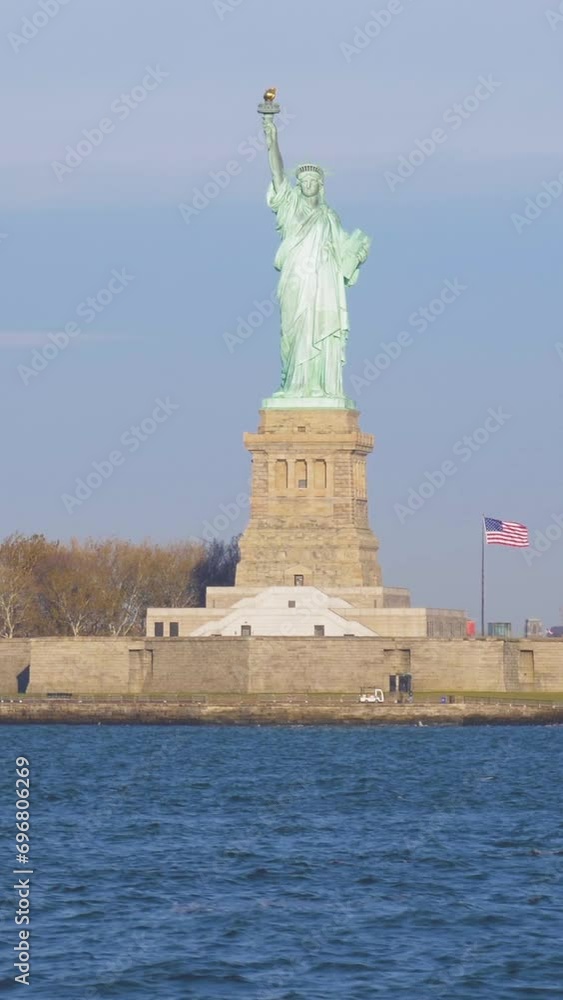 Statue of Liberty in the Sunny Day. New York City, United States of America. View from the Water. Steadicam Shot. Vertical Video Statue of Liberty in the Sunny Day. New York City, United States of America. View from the Water. Steadicam Shot. Vertical Video
