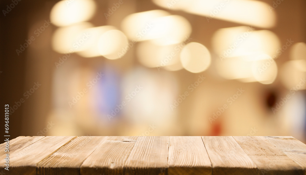 empty wooden brown table on blurred light gold bokeh cafe restaurant bar, place for your products on the table. Abstract background empty wooden brown table on blurred light gold bokeh cafe restaurant bar, place for your products on the table. Abstract background