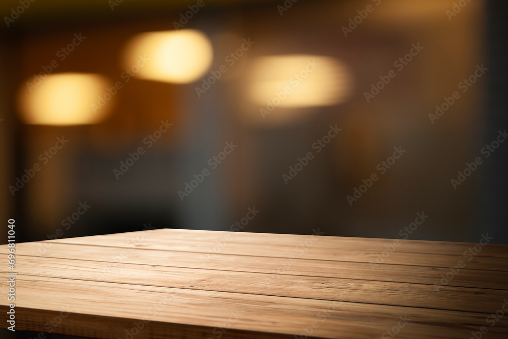 empty wooden brown table on blurred light gold bokeh cafe restaurant bar, place for your products on the table. Abstract background empty wooden brown table on blurred light gold bokeh cafe restaurant bar, place for your products on the table. Abstract background