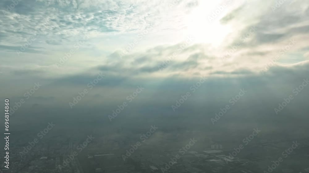 Aerial view of Saigon cityscape at morning with misty sun rays sky in Southern Vietnam. Urban development texture, transport infrastructure and green parks Aerial view of Saigon cityscape at morning with misty sun rays sky in Southern Vietnam. Urban development texture, transport infrastructure and green parks