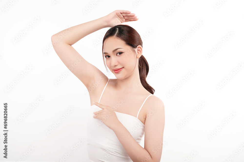 Beautiful Young Asian woman lifting hands up to show off clean and hygienic armpits or underarms on white background, Smooth armpit cleanliness and protection concept Beautiful Young Asian woman lifting hands up to show off clean and hygienic armpits or underarms on white background, Smooth armpit cleanliness and protection concept
