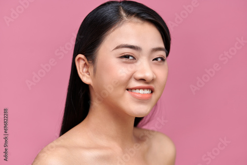 Close up of young beautiful woman with clear and pure skin