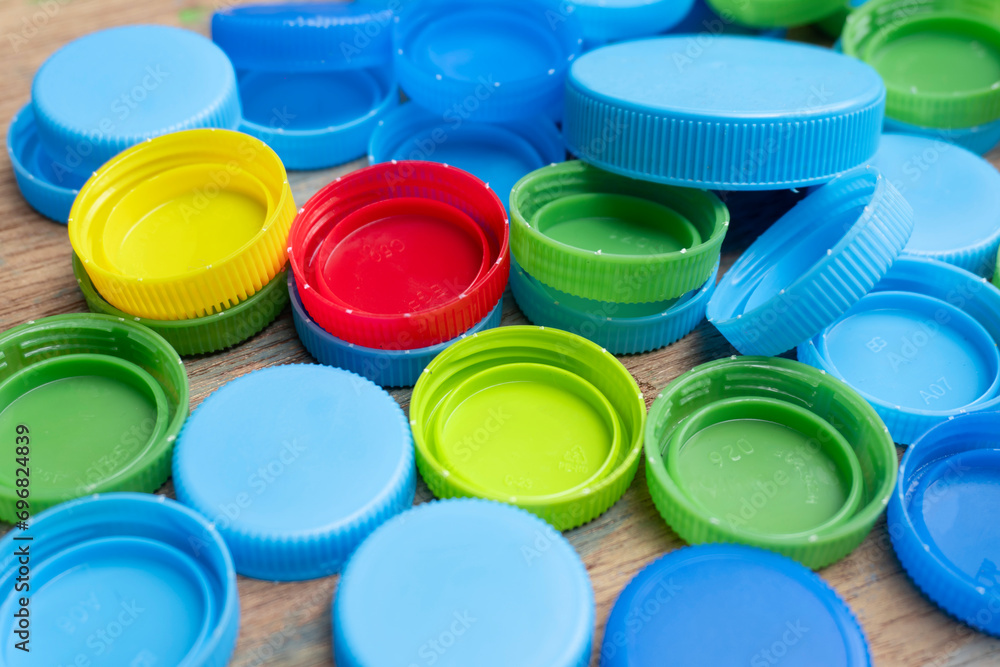 Various plastic caps for recycling, water bottle caps, waste management. Various plastic caps for recycling, water bottle caps, waste management.