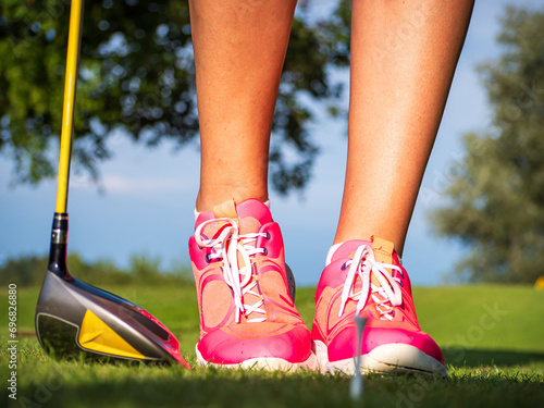 Golf Woman waiting for next Golf actions during sunset weather phase photo